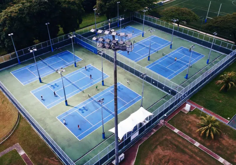 Photo of POP tennis courts outdoors.